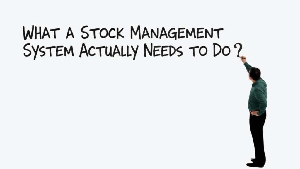 Person writing "What a Stock Management System Actually Needs to Do" on a white background