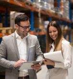 Supply Chain Risk Management professionals reviewing warehouse operations