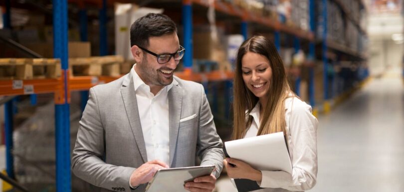 Supply Chain Risk Management professionals reviewing warehouse operations