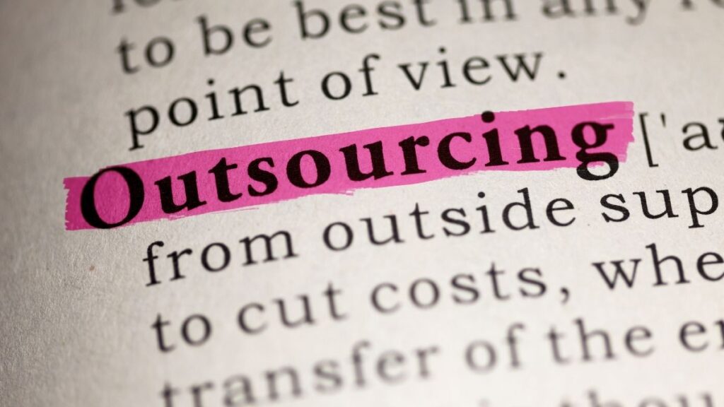 Outsourcing highlighted in business text