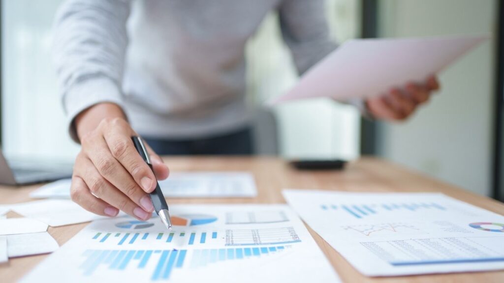 Financial reports and charts being reviewed