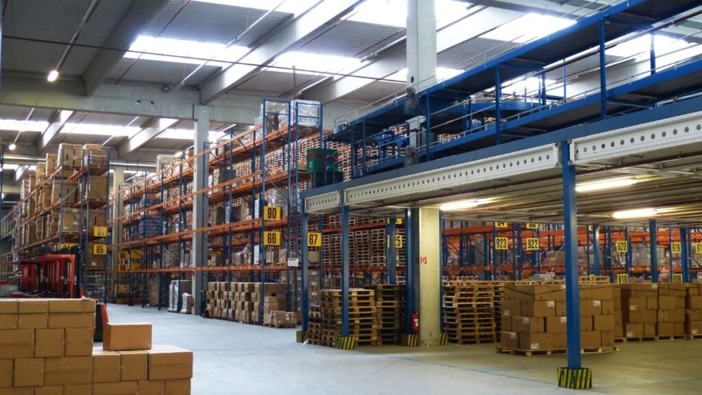 Warehouse storage racks filled with boxes and pallets.
